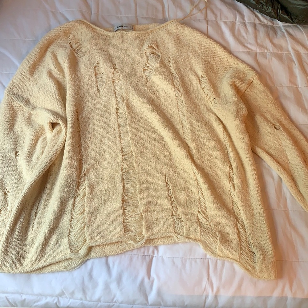 Distressed knit sweater